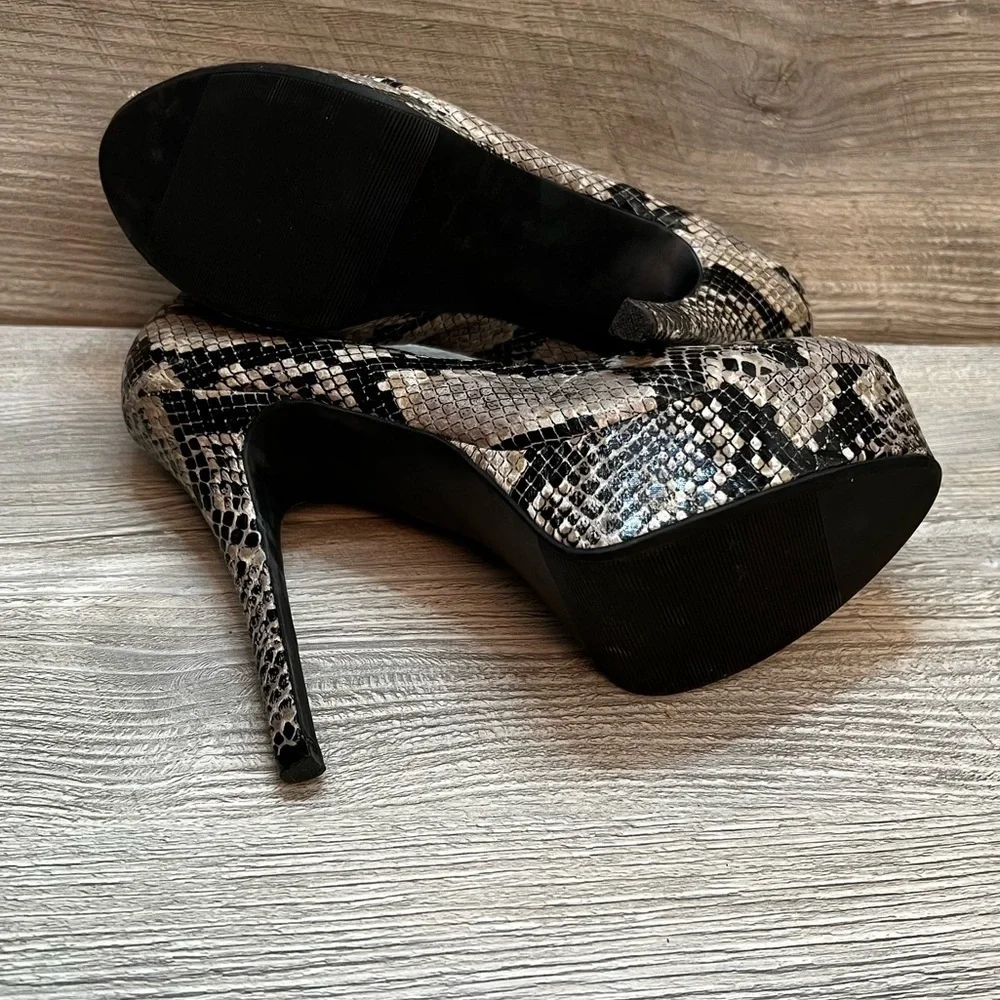 Olsenboye tall platform snakeskin patterned high heels. Closed toe size 9